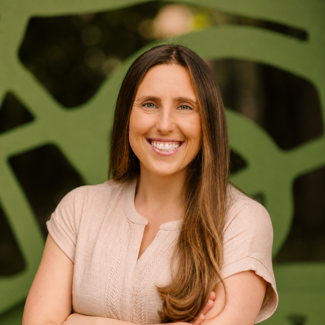 Sophie Schauermann, MSW, LCSW, Founder and CEO, smiling with arms crossed